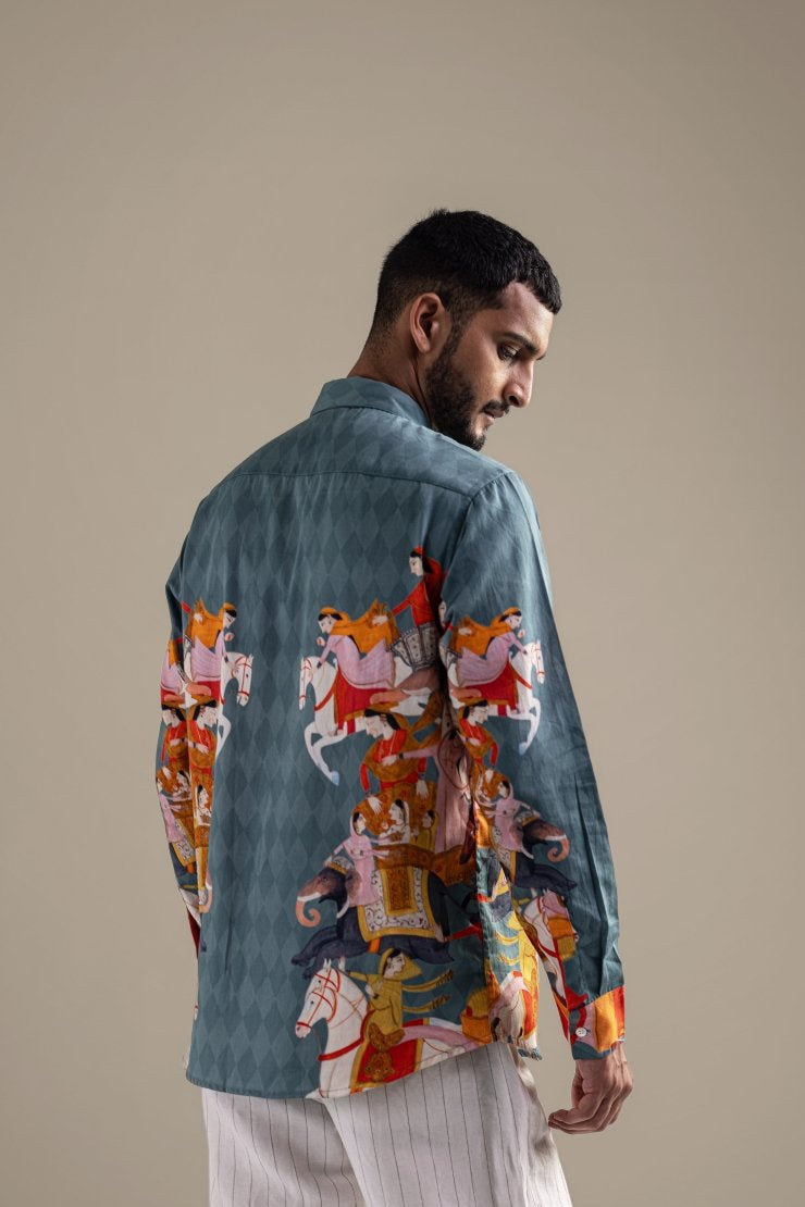 Man wearing the Kirtharjuna shirt, close back view, looking down