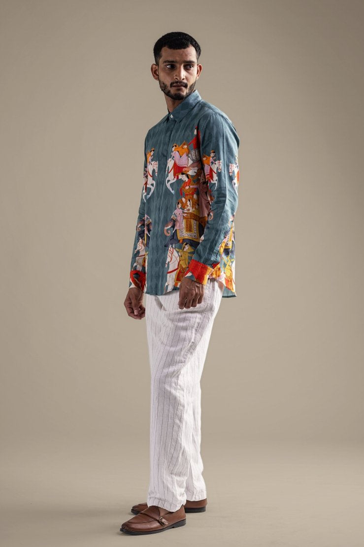 Man wearing the Kirtharjuna shirt, full length side view, looking away